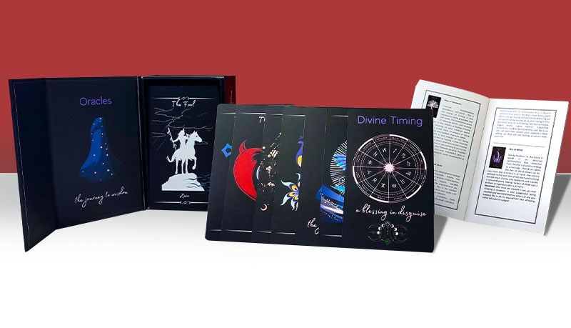 A selection of self-published custom tarot card decks, boxes, and booklets we have printed for our clients